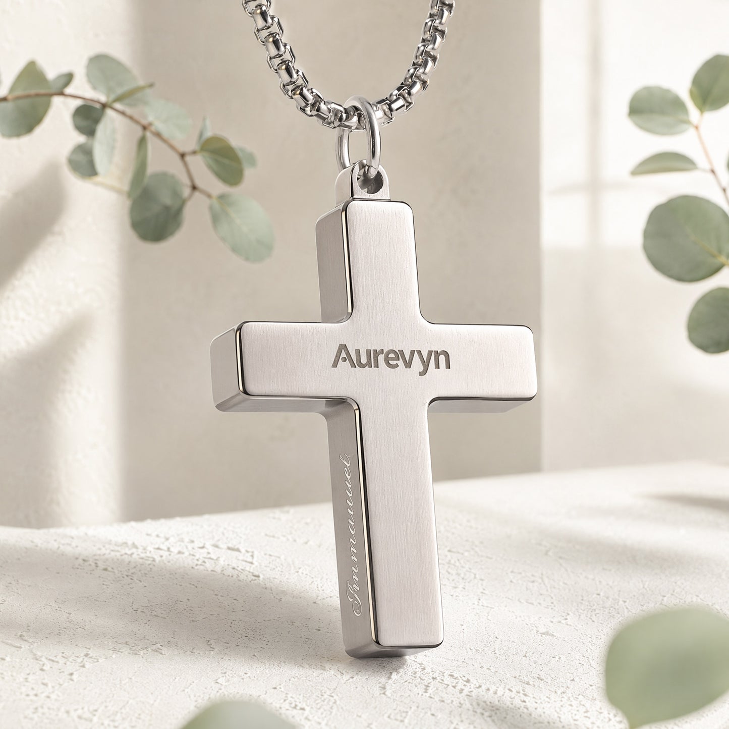 Back view of the Aurevyn Grid NFC cross necklace with the engraved Aurevyn logo