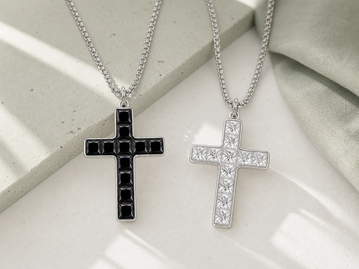 Black and white Aurevyn Grid cross necklaces in natural light
